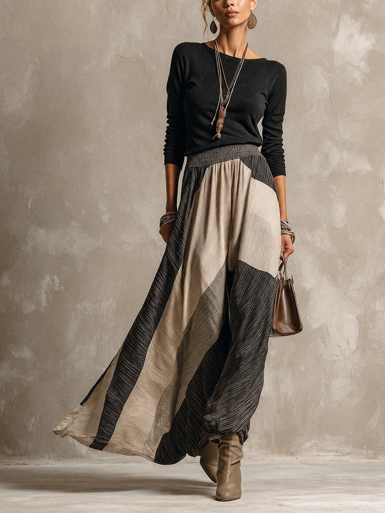 Black top and color-block pleated maxi skirt set