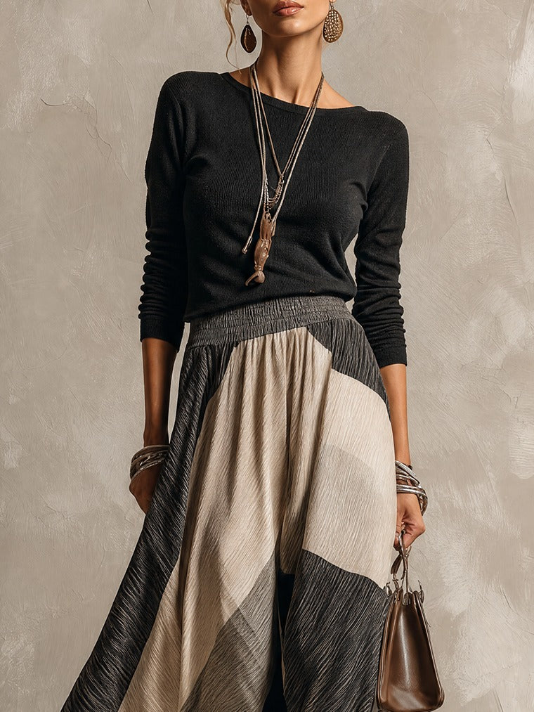 Black top and color-block pleated maxi skirt set